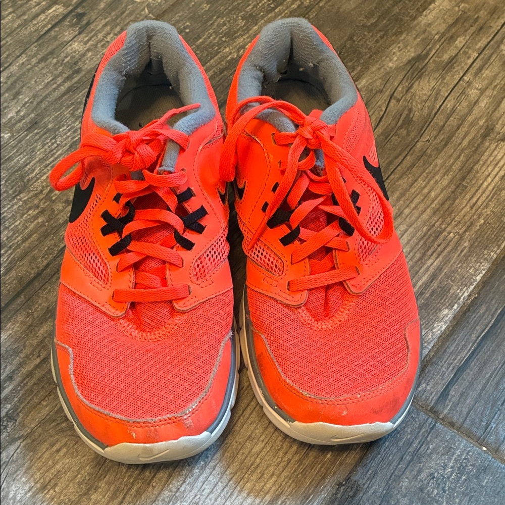 Nike Flex Experience RN3     Women’s Orange and Black Sneakers